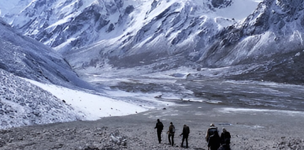 Trekkers walking through the snowy landscapes of Langtang Valley during the Langtang Valley Trek.